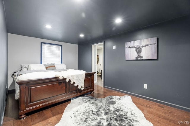 bedroom featuring dark hardwood / wood-style flooring