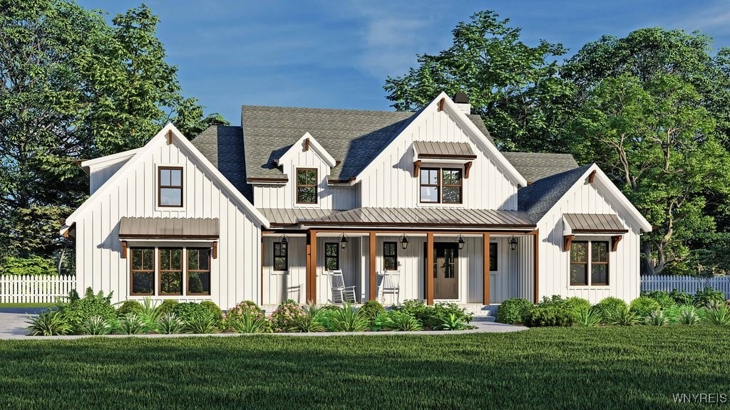 modern farmhouse style home with a front lawn and a porch