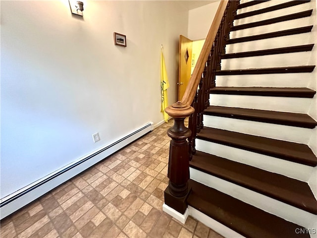 staircase with a baseboard radiator