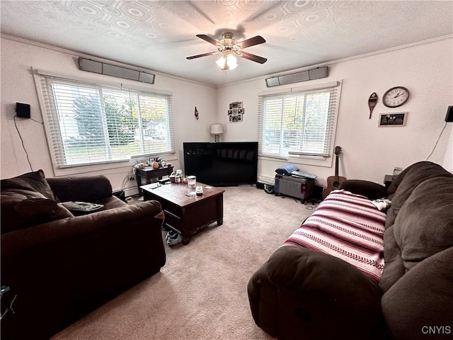 living room with ceiling fan, light carpet, and a healthy amount of sunlight