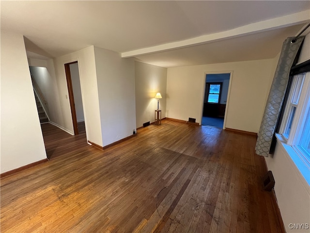 spare room featuring dark hardwood / wood-style flooring