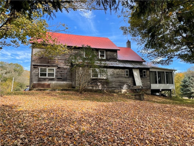 view of front of home with a sunroom