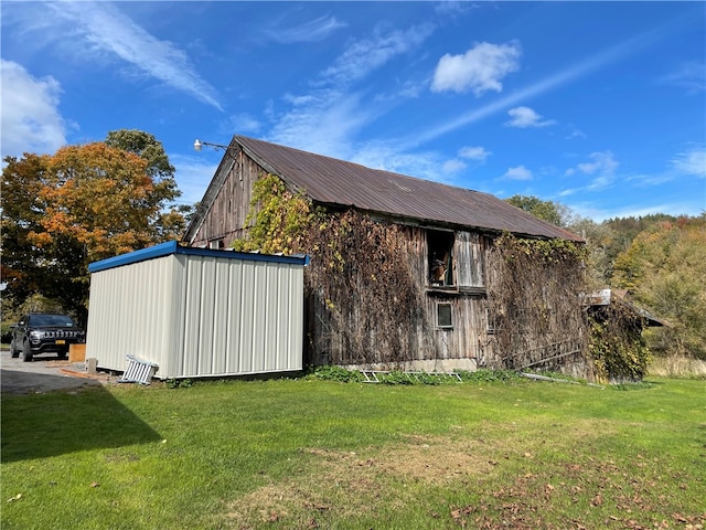 view of property exterior featuring a lawn