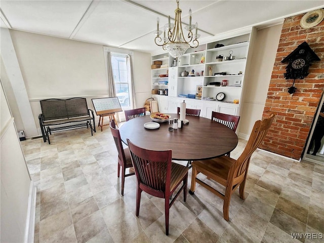 dining area with an inviting chandelier