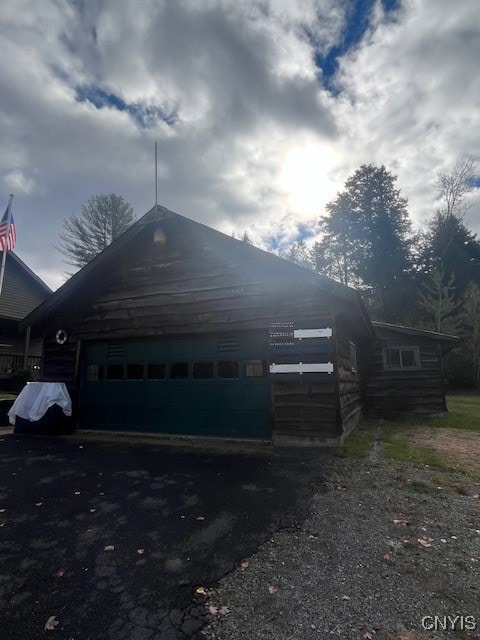 view of property exterior featuring a garage