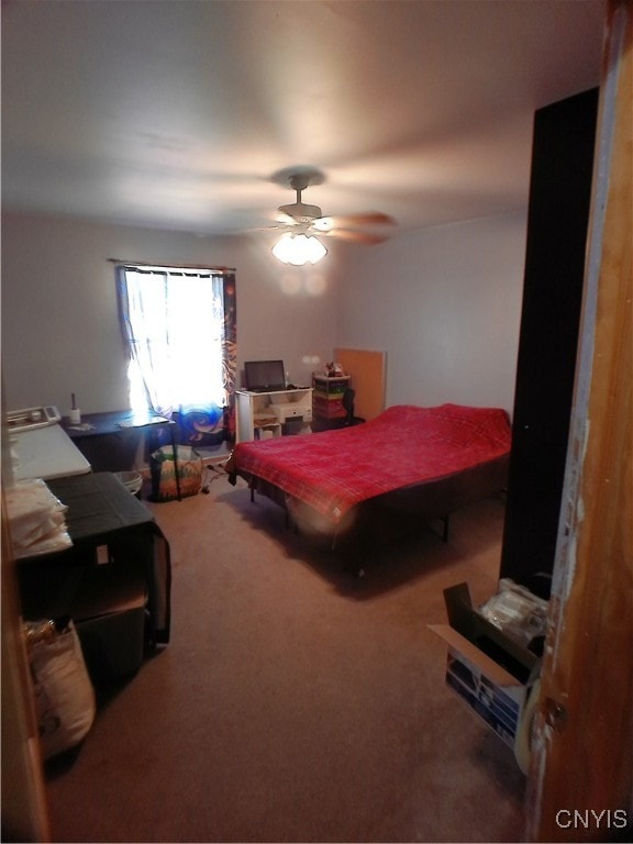 carpeted bedroom with ceiling fan