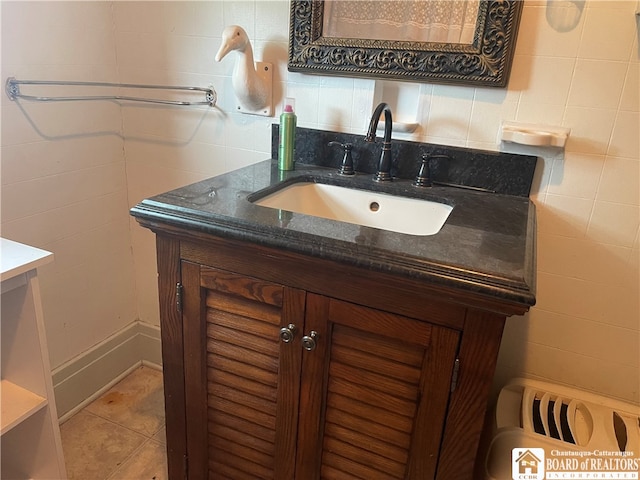 bathroom with tile patterned floors and vanity