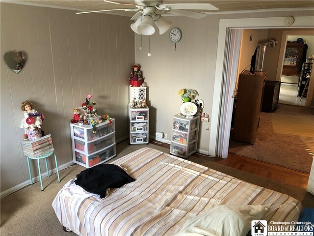 bedroom with ceiling fan and hardwood / wood-style floors