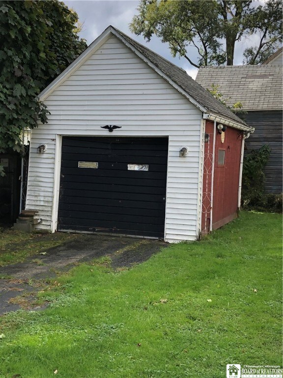 garage featuring a yard