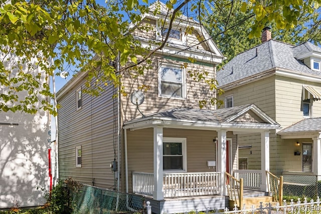 view of property with covered porch