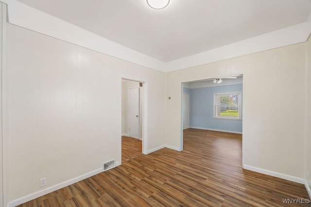 empty room featuring dark hardwood / wood-style floors