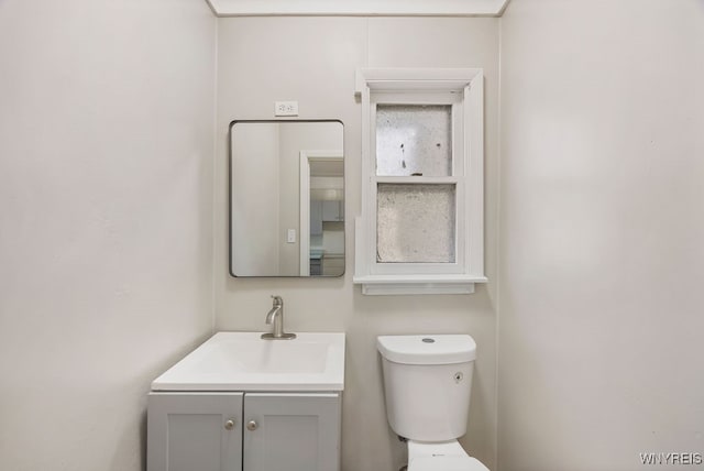 bathroom with toilet and vanity