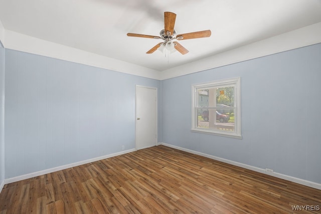 unfurnished room featuring ceiling fan and hardwood / wood-style floors