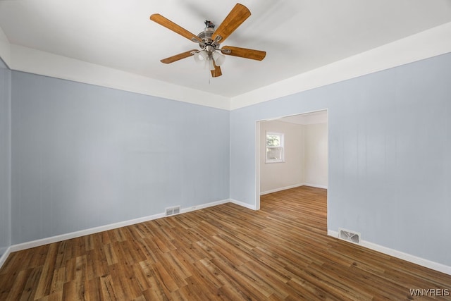 unfurnished room with hardwood / wood-style floors and ceiling fan