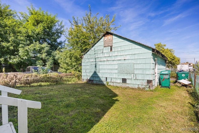 view of outdoor structure with a lawn