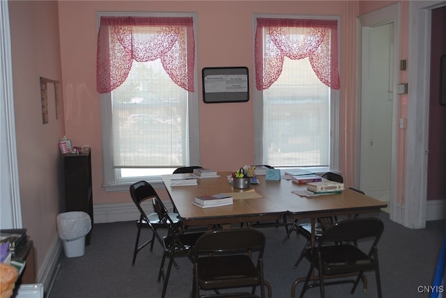 carpeted dining space featuring plenty of natural light