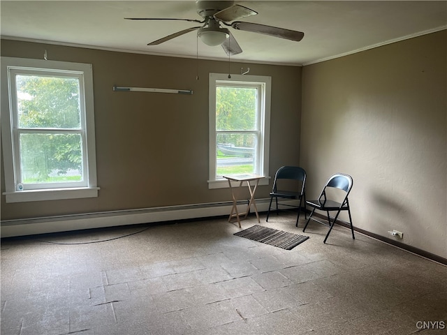 empty room with ceiling fan, a baseboard radiator, crown molding, and a wealth of natural light