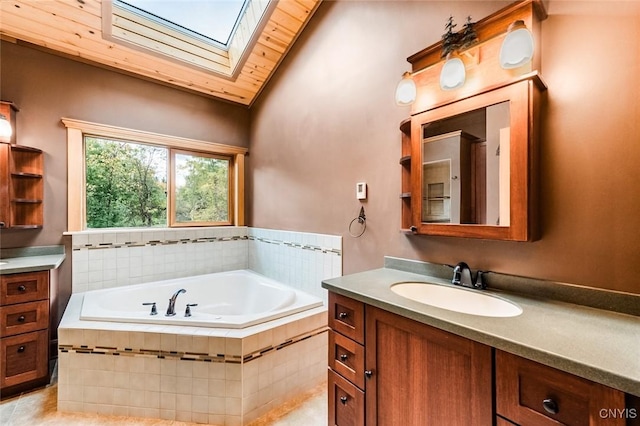 bathroom with vanity, lofted ceiling with skylight, tiled tub, wooden ceiling, and tile patterned flooring