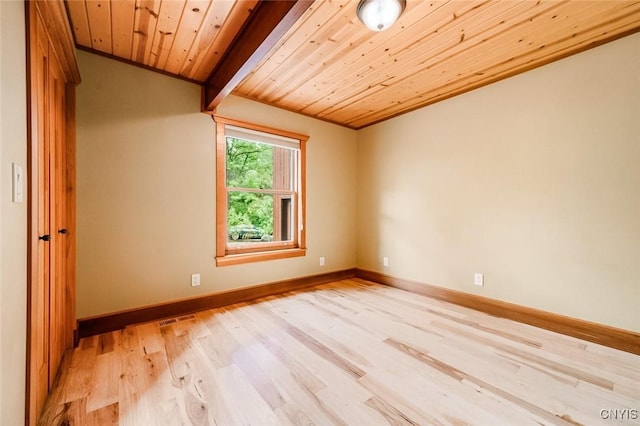 interior space featuring light hardwood / wood-style flooring, wood ceiling, and ornamental molding