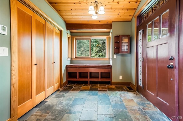 mudroom with plenty of natural light, wooden ceiling, and an inviting chandelier