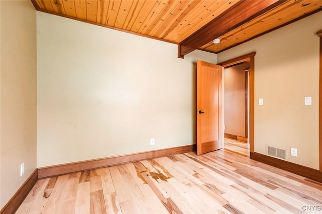 empty room featuring wooden ceiling, ornamental molding, and light hardwood / wood-style flooring