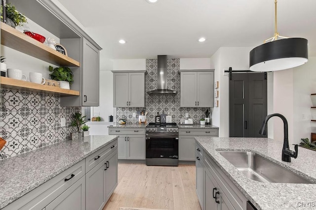 LOT64 Chillingham Way, Lysander, NY 13027 - kitchen featuring wall chimney range hood, gas stove, gray cabinets, a sink, and recessed lighting