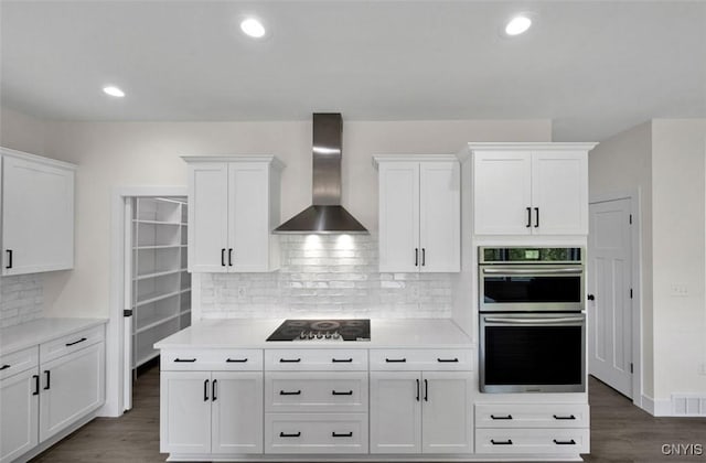 LOT64 Chillingham Way, Lysander, NY 13027 - kitchen with wall chimney exhaust hood, black electric stovetop, double oven, white cabinets, and recessed lighting