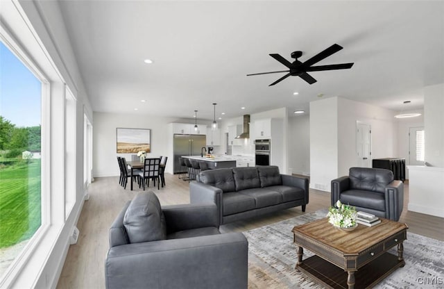 LOT64 Chillingham Way, Lysander, NY 13027 - living room with light wood-style flooring, ceiling fan, and recessed lighting