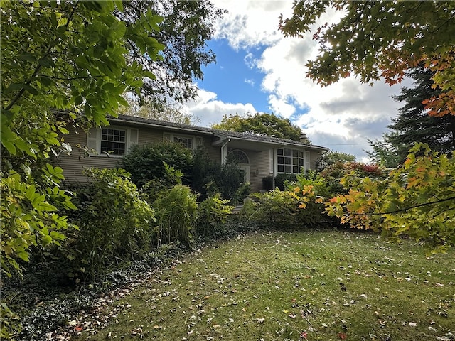 exterior space featuring a front lawn