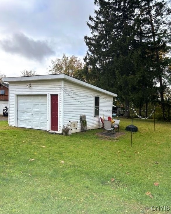 garage featuring a yard