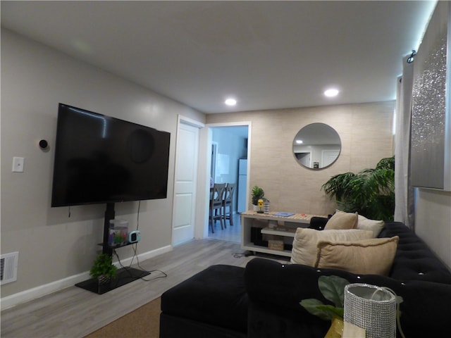 living room with light hardwood / wood-style flooring