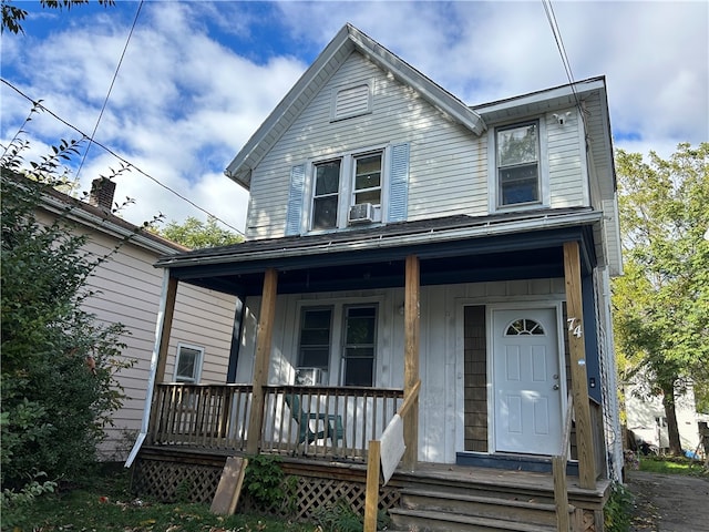 view of front facade with cooling unit and a porch