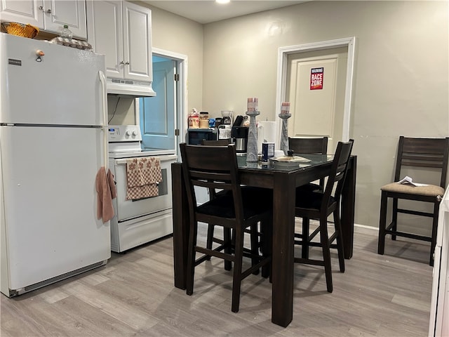 dining space featuring light hardwood / wood-style flooring