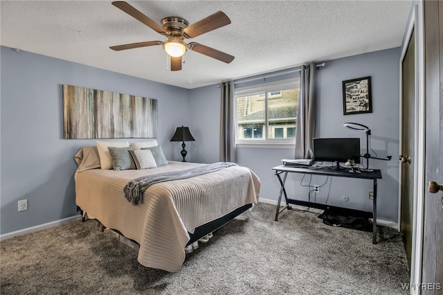 carpeted bedroom with ceiling fan and a textured ceiling