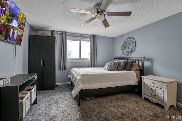 carpeted bedroom featuring a textured ceiling and ceiling fan