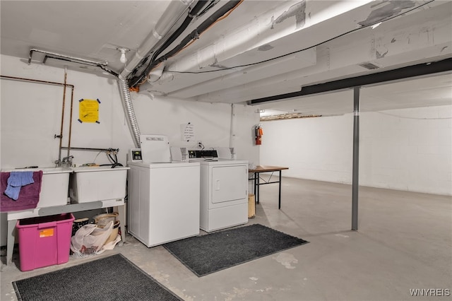 clothes washing area with independent washer and dryer