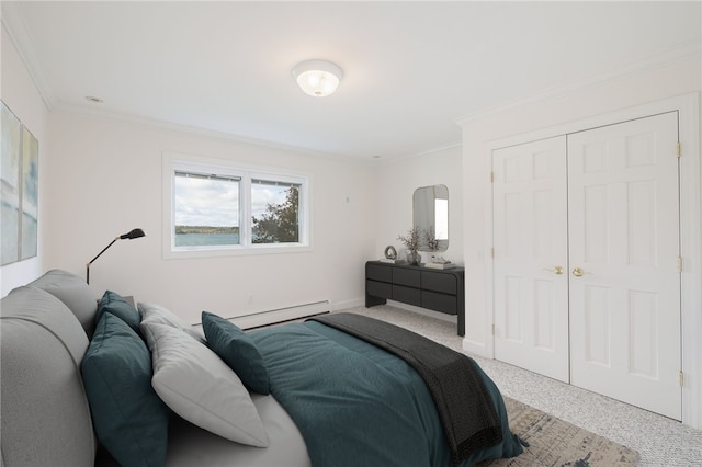 bedroom featuring carpet, baseboards, a baseboard radiator, ornamental molding, and a closet