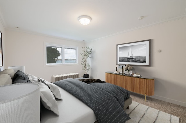 bedroom featuring light colored carpet, radiator, baseboards, and ornamental molding