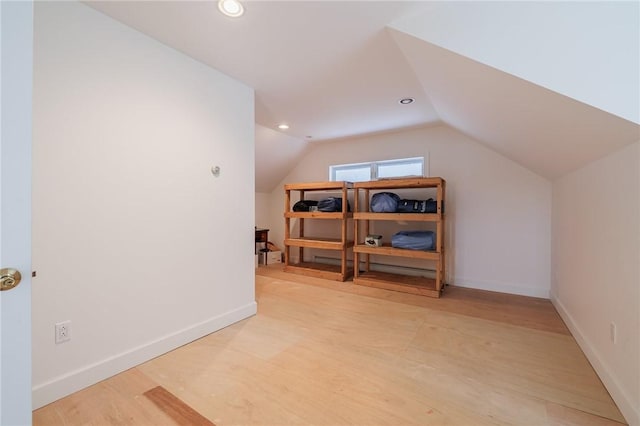 bonus room featuring recessed lighting, light wood-style flooring, baseboards, and lofted ceiling