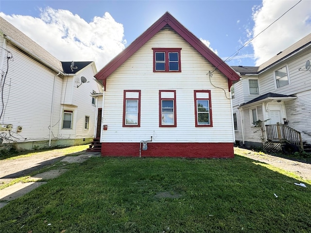 view of property exterior featuring a lawn