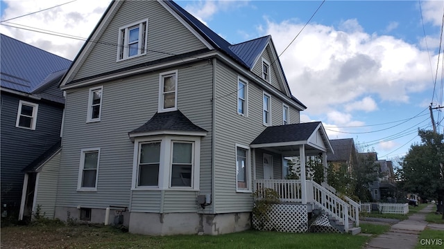 view of home's exterior with a porch