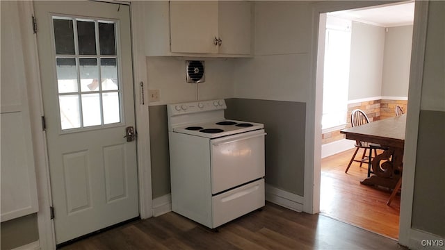 kitchen with white cabinets, white electric range, and dark hardwood / wood-style floors