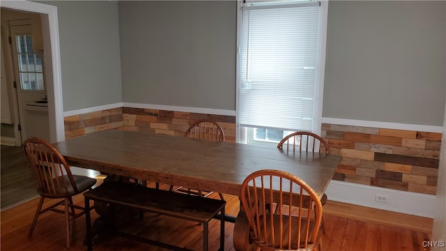 dining space featuring wood-type flooring