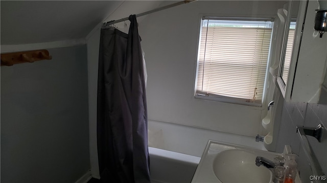 bathroom featuring sink and shower / bath combo with shower curtain