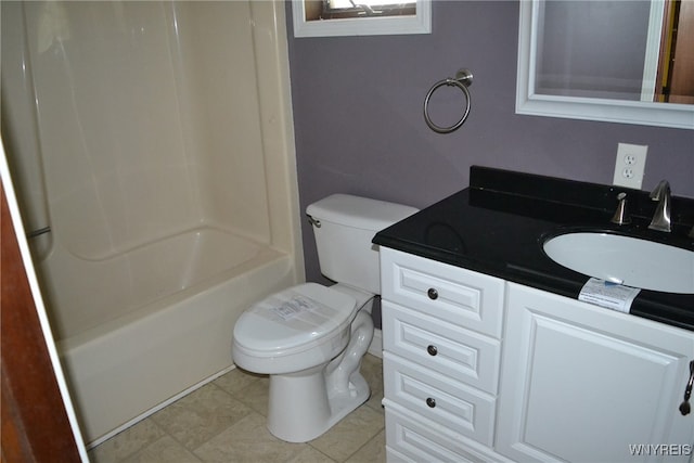 full bathroom featuring vanity, bathing tub / shower combination, toilet, and tile patterned floors