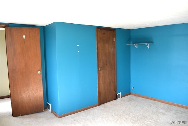 unfurnished bedroom with carpet floors