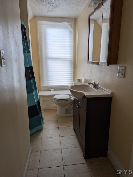 bathroom with vanity, a shower with shower curtain, tile patterned flooring, toilet, and a textured ceiling