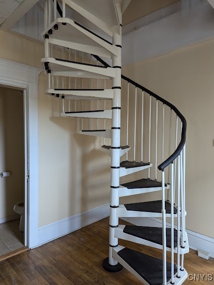 stairs with wood-type flooring