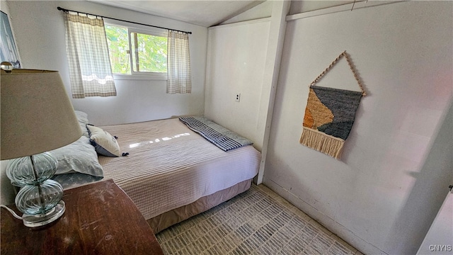 bedroom featuring lofted ceiling