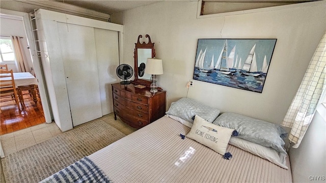 bedroom featuring a closet and light wood-type flooring